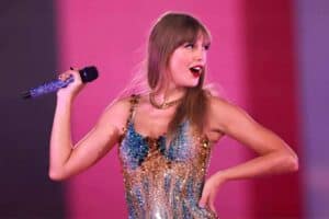 Taylor Swift holding a mic