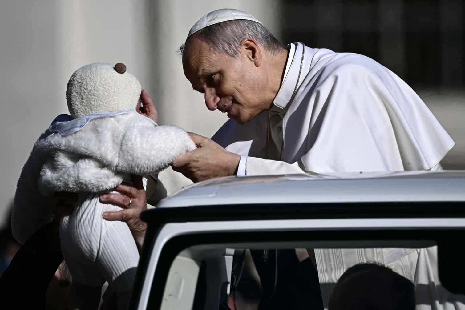 Pope Leo XIV blesses a baby