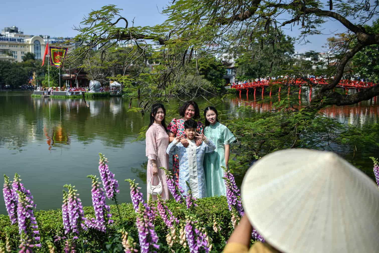 A family poses for photos during the Lunar New Year
