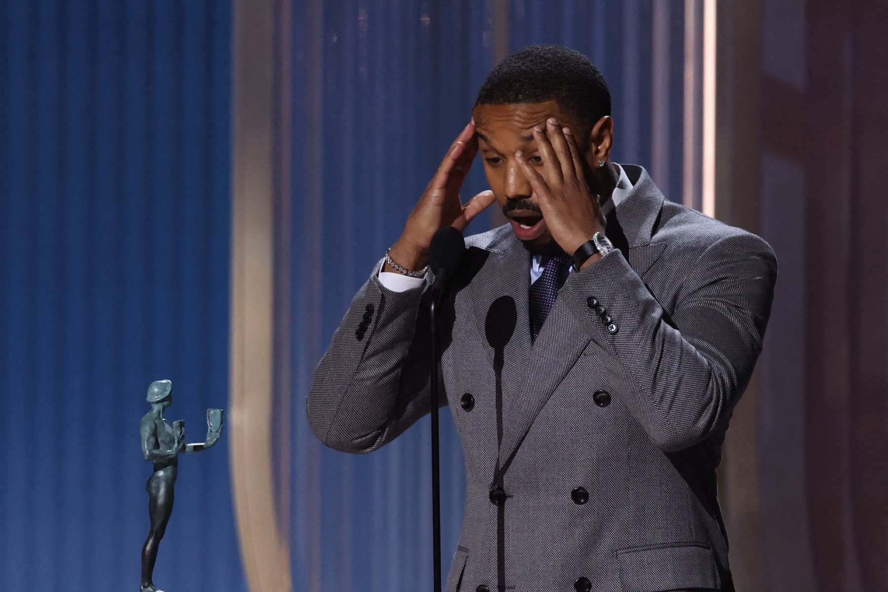 US actor Michael B. Jordan accepts the award for Outstanding Performance by a Male Actor in a Leading Role in a Motion Picture for 