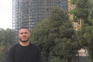 Ward 87 councillor Kyle Jacobs stands in front of the new Brixton reservoir and tower.
