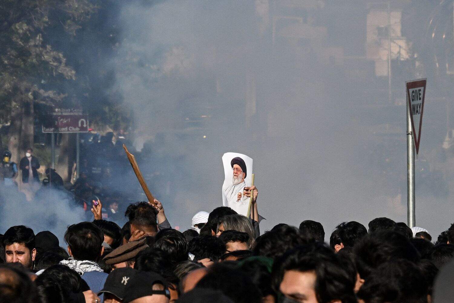 A Shiite Muslim holds a portrait of Iran's late supreme leader Ayatollah Ali Khamenei as they attempt to storm the US embassy in Islamabad on 1 March 2026 to condemn his death amid US-Israel strikes. At least nine people were killed during pro-Iran protests at the United States consulate in the Pakistan megacity of Karachi on 1 March, according to a hospital toll seen by AFP. Picture: Aamir QURESHI / AFP