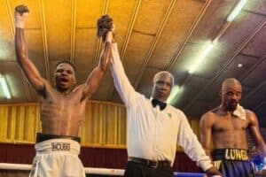 Ndodana Ncube, Gezani Hlungwani (official, Boxing SA) and Lunga Stimela. Ncube collapsed shortly after the fight in the changing rooms.