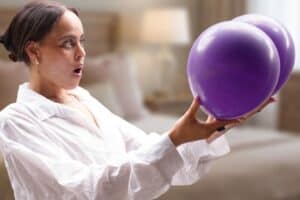 Injecting saline or silicone into scrotums