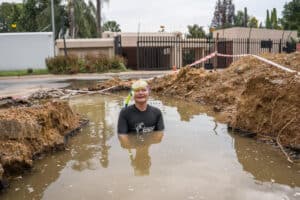 Helen Zille swimming in a giant hole.