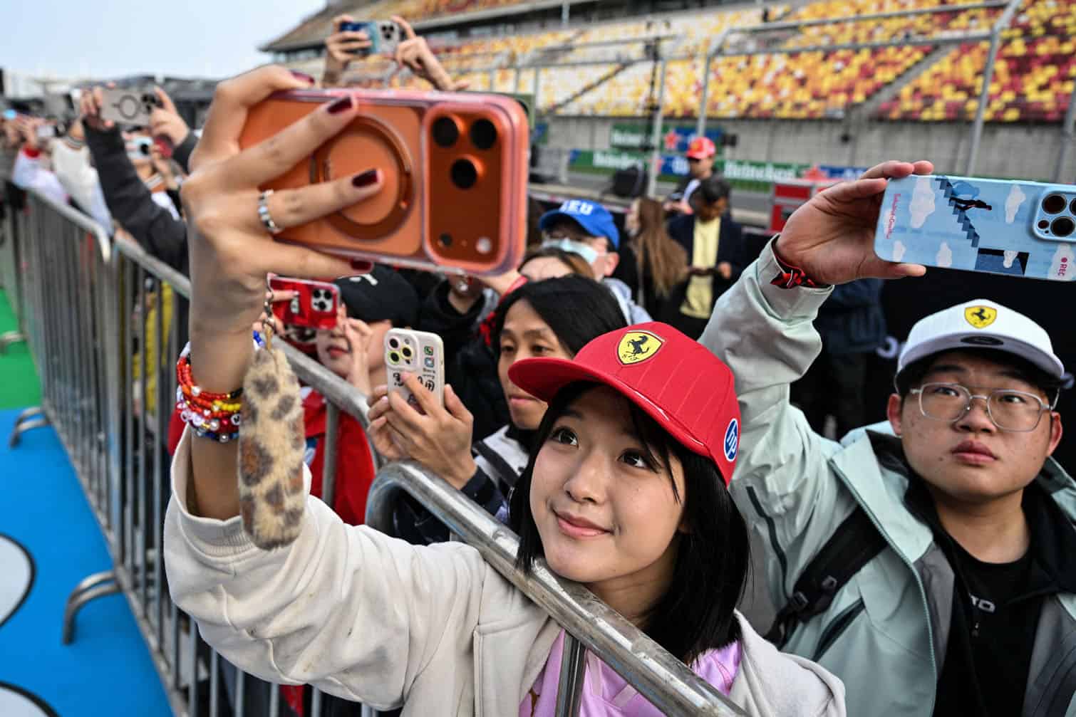 Fans watch Ferrari's team members