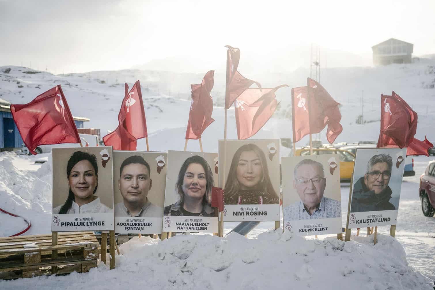 Placards bearing the portraits of candidates from Greenland's democratic socialist party