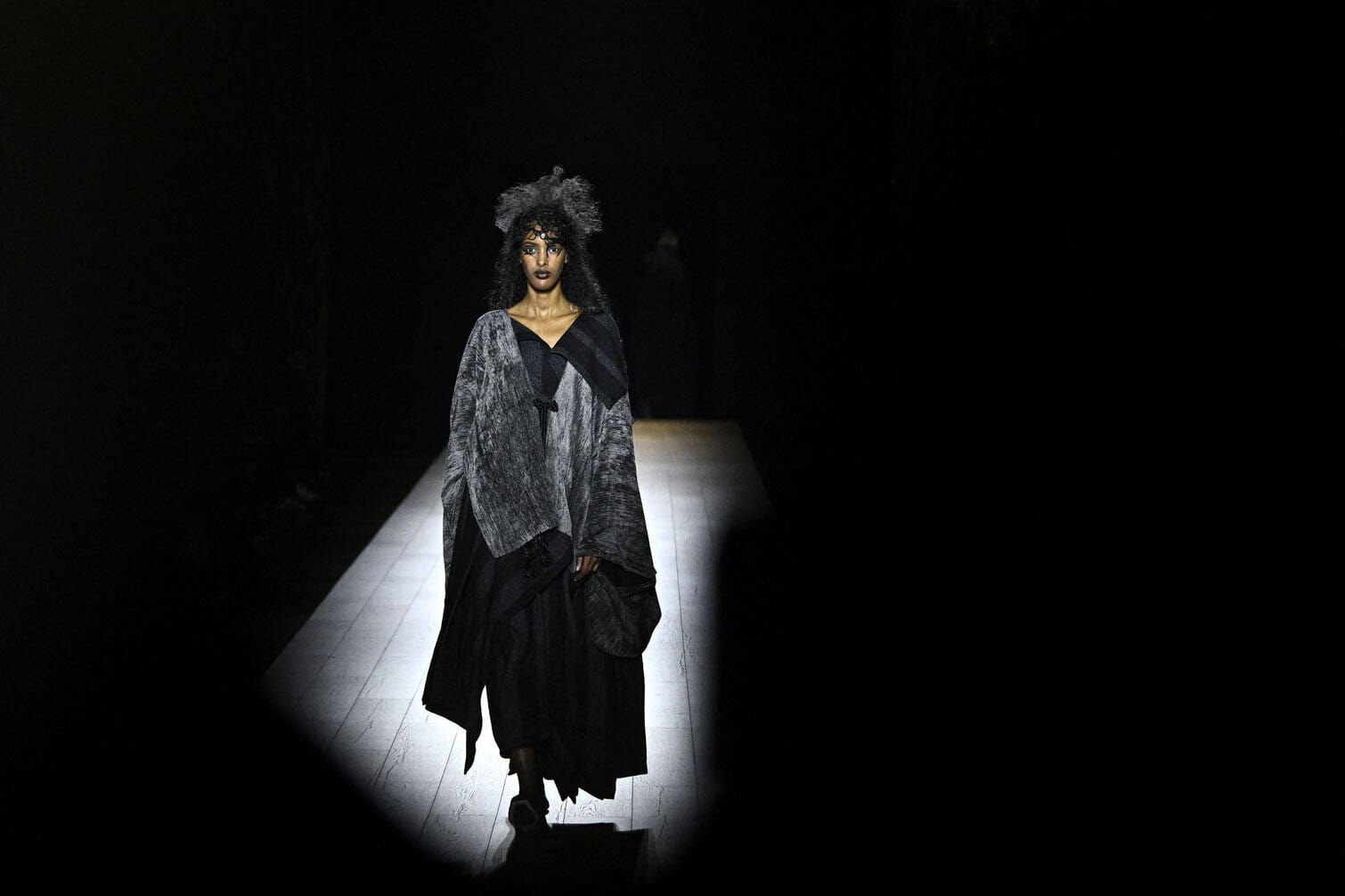 A model presents a creation by Yohji Yamamoto