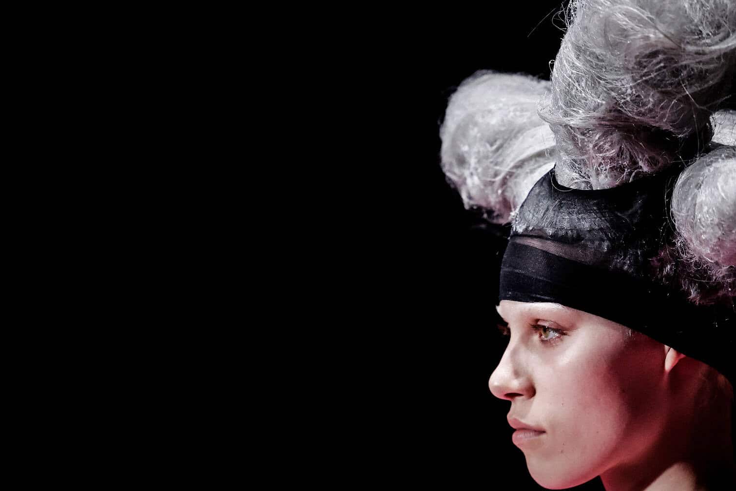 A model presents a creation for Comme des Garcons