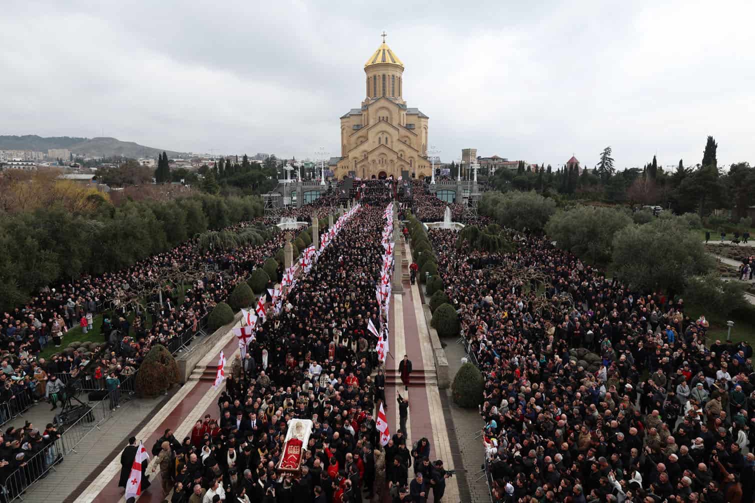 Mourners follow the coffin of the late Georgia's Orthodox Patriarch Ilia II