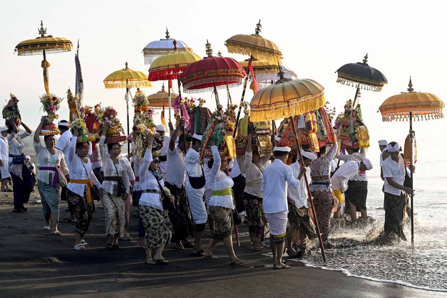 Hindu devotees take part in a Melasti ceremony