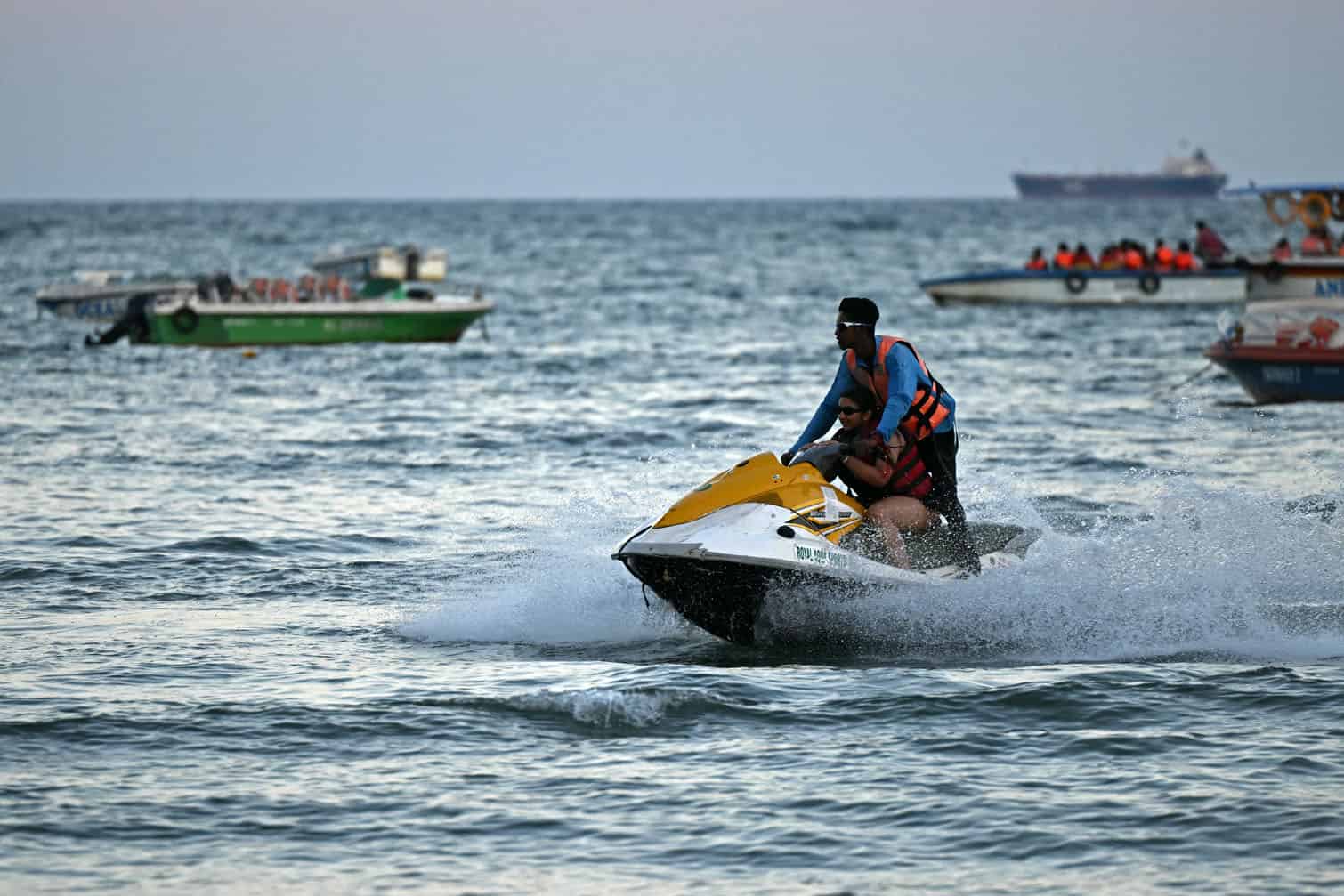 A tourist enjoys a jet ski ride