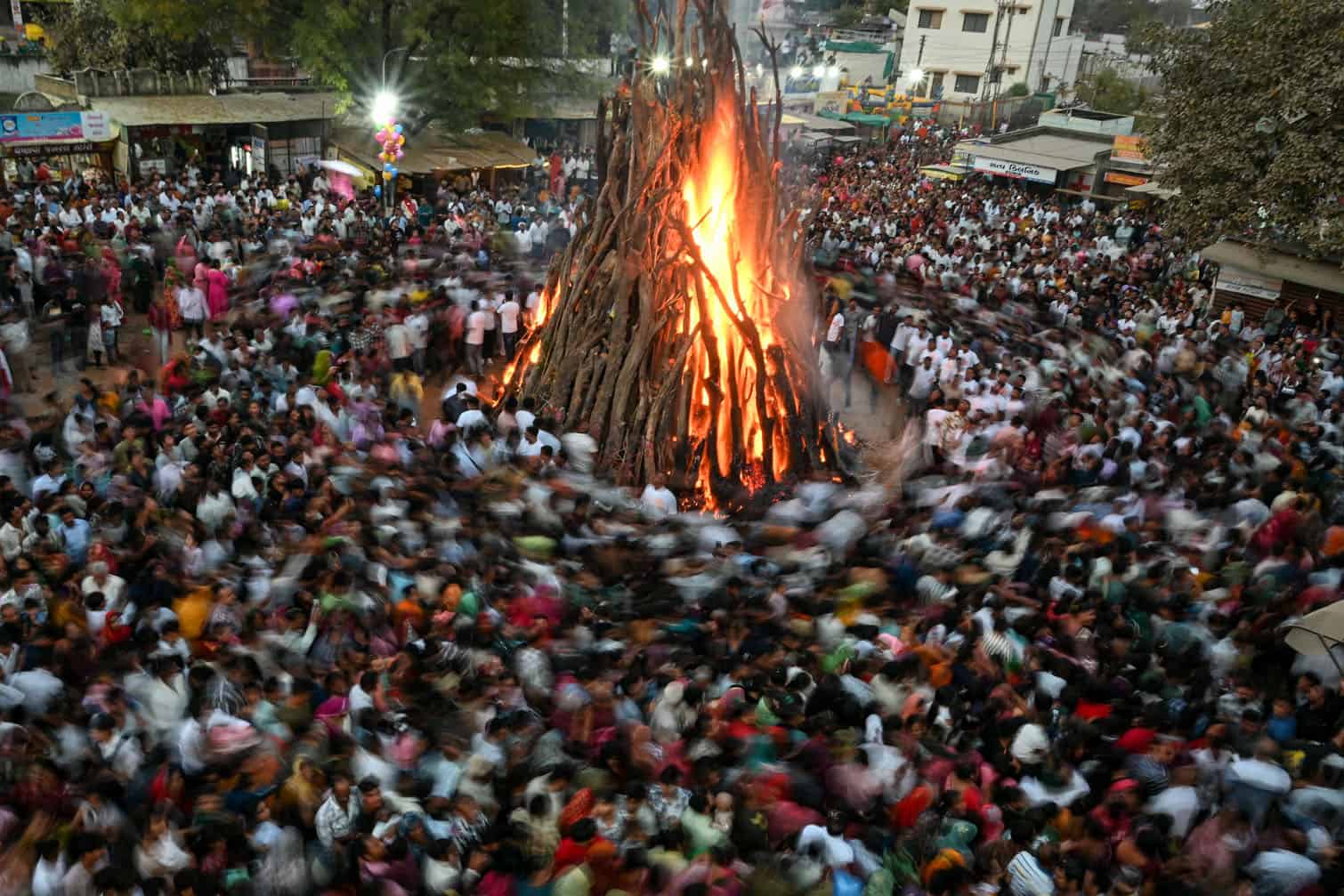 Devotees perform rituals around a sacred fire