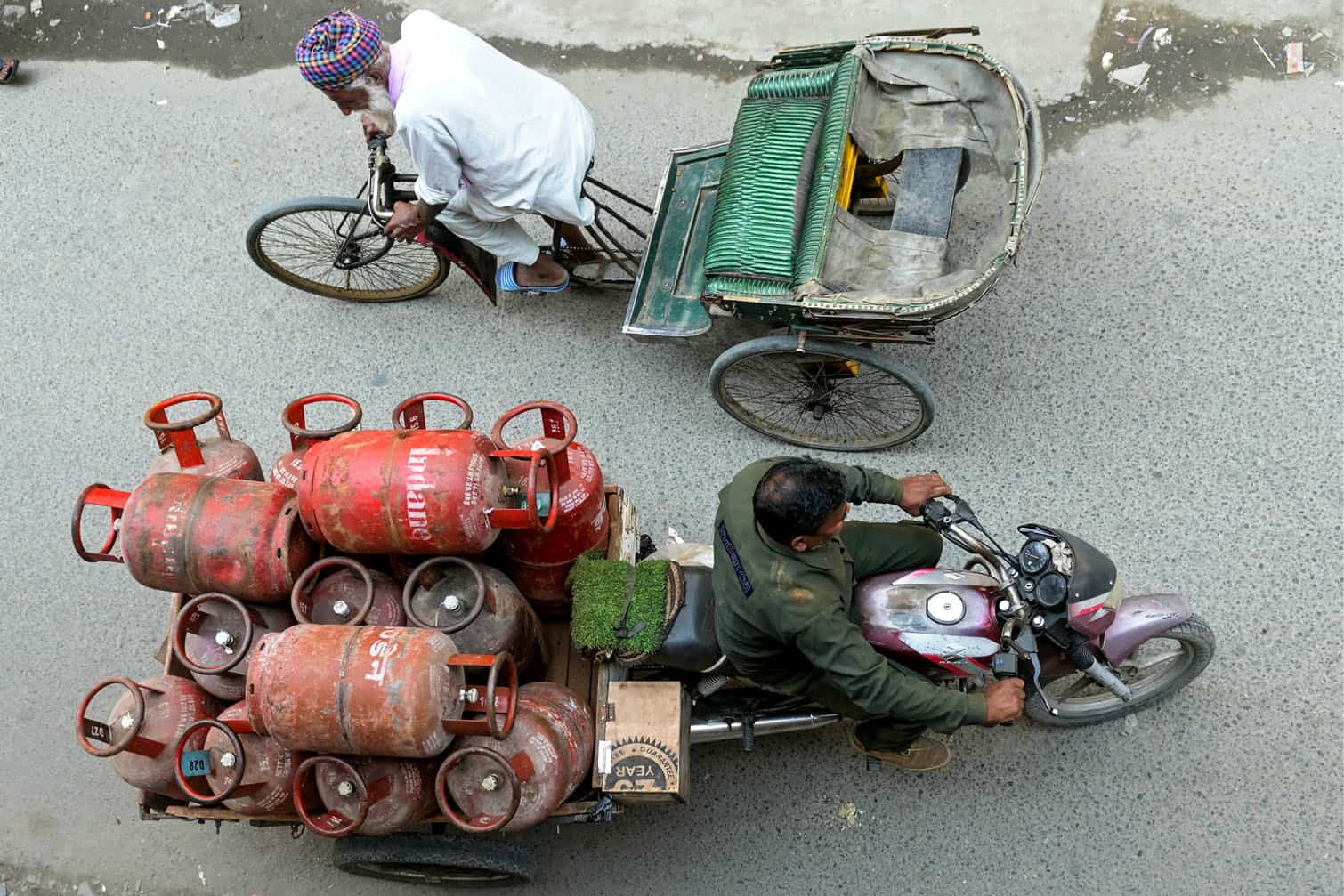 A delivery man transports liquid petroleum gas