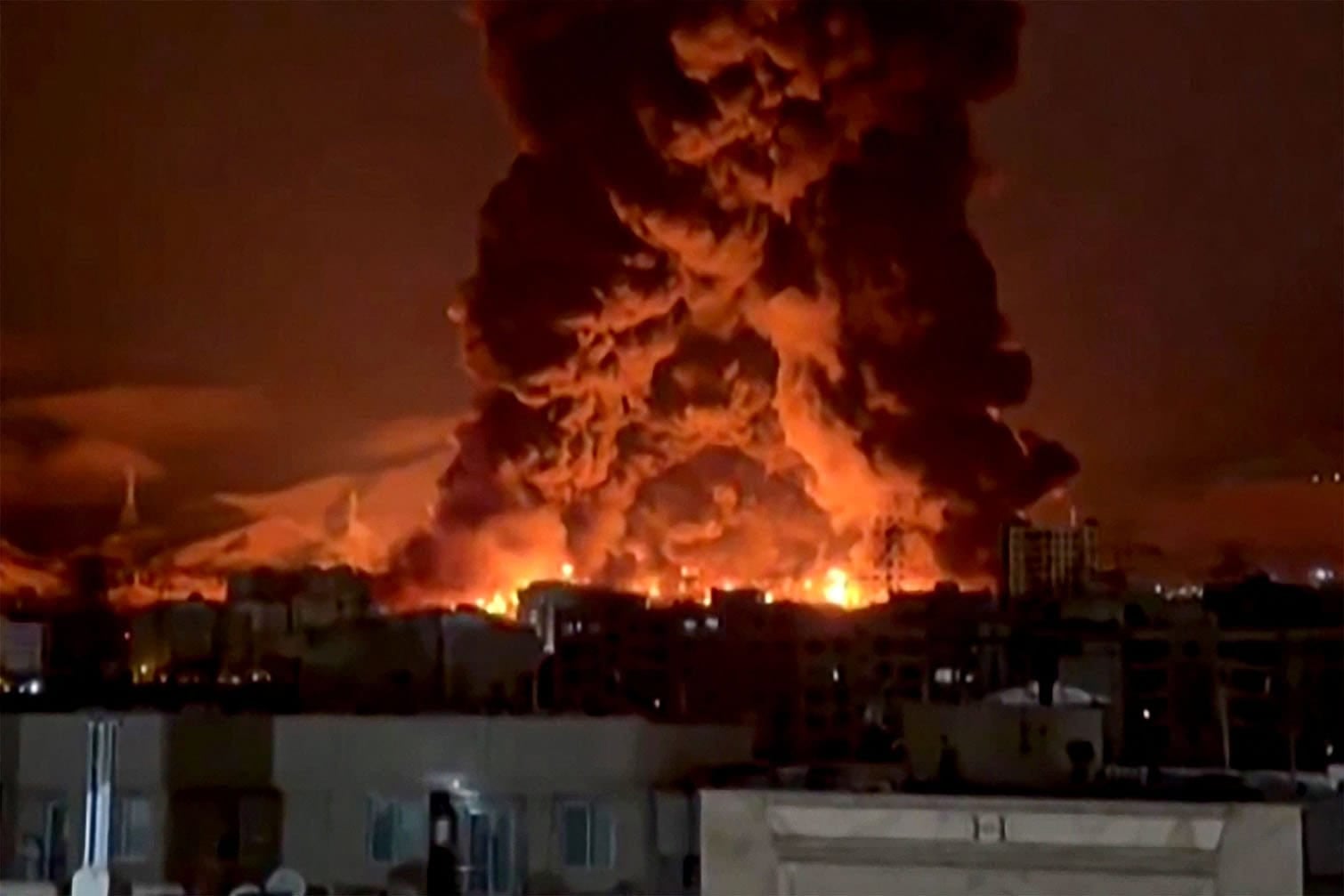 fire erupting at an oil depot in Iran