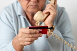 Senior pensioner reads card details telephonically-