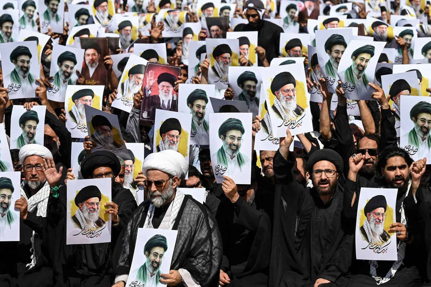 Shia Muslims holding portraits