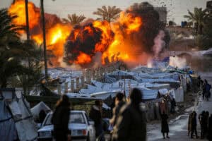 A fireball erupts following an Israeli strike near a tent encampment