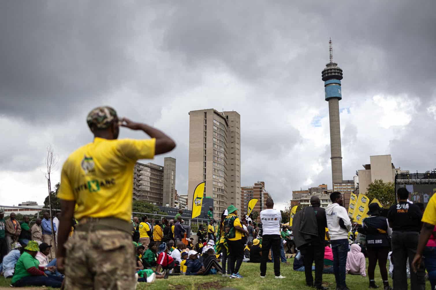 A supporter salutes as the national anthem is played