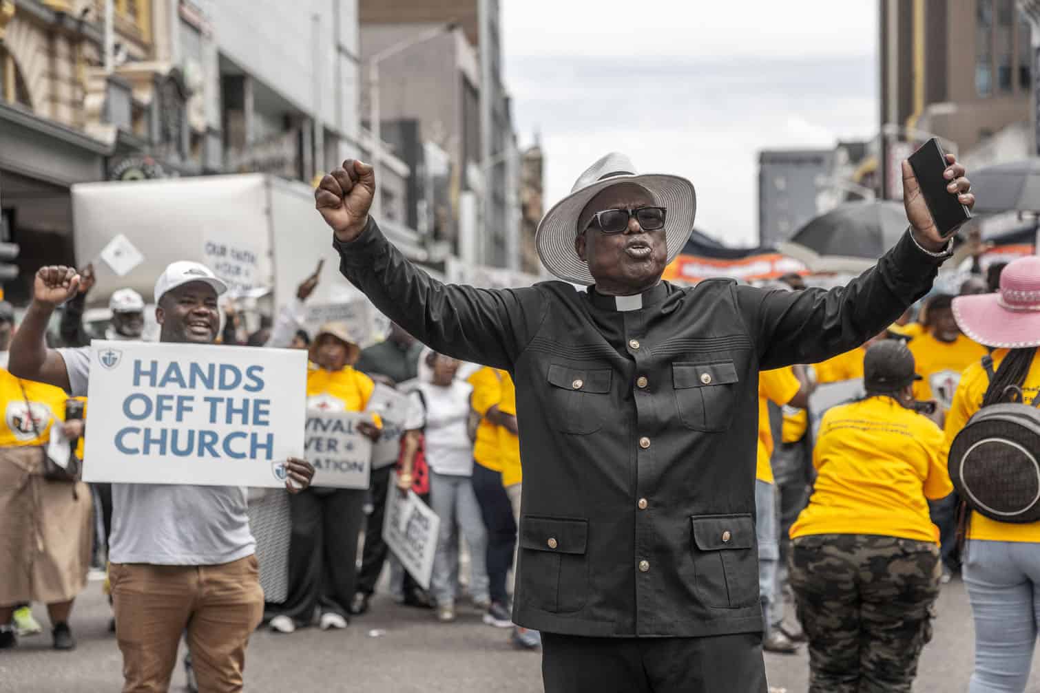 A local pastor gestures during a protest march in Durban