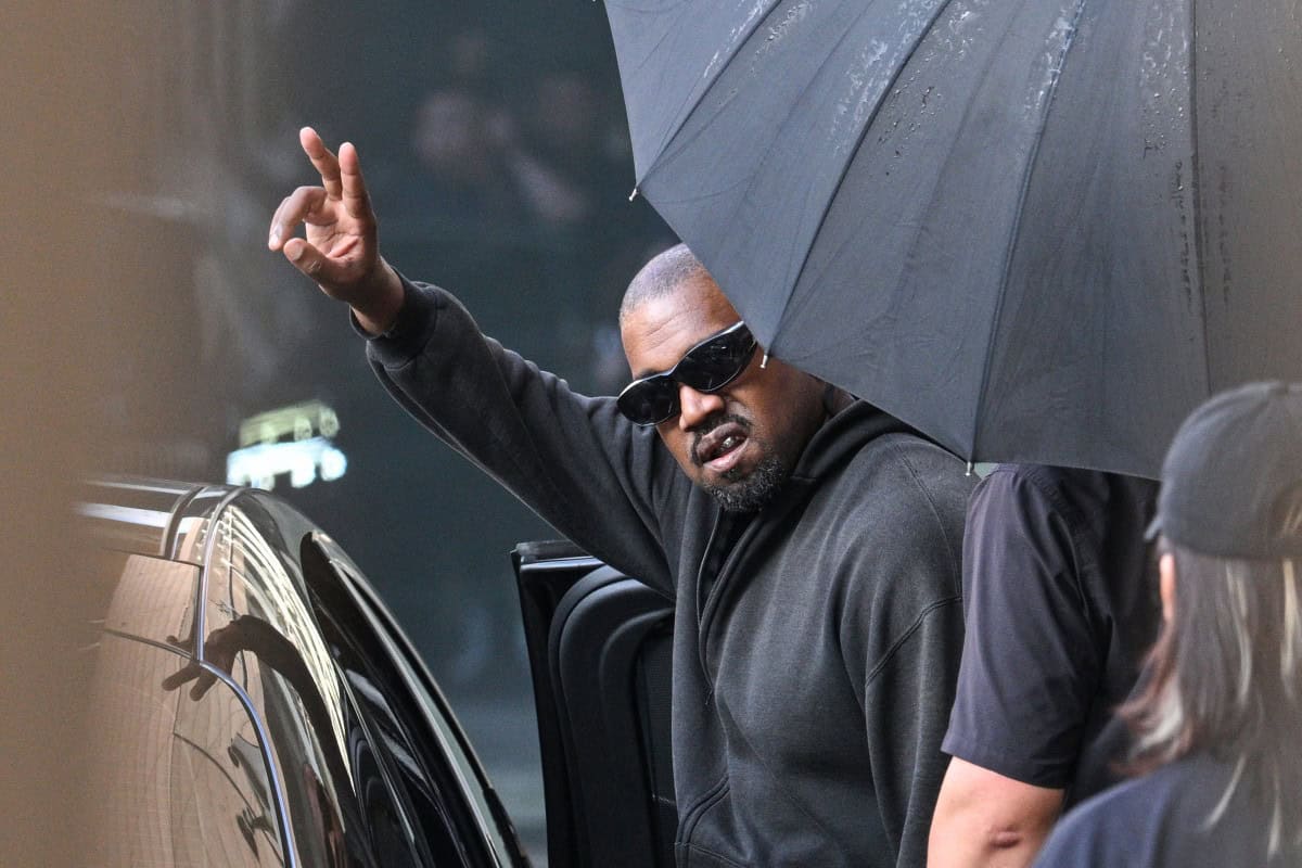 US rapper and producer Kanye West gestures upon arriving at Shanghai Pudong International Airport on 11 July 2025. Picture: Hector RETAMAL / AFP