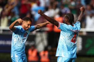 DR Congo fans dance in the rain after sealing World Cup spot