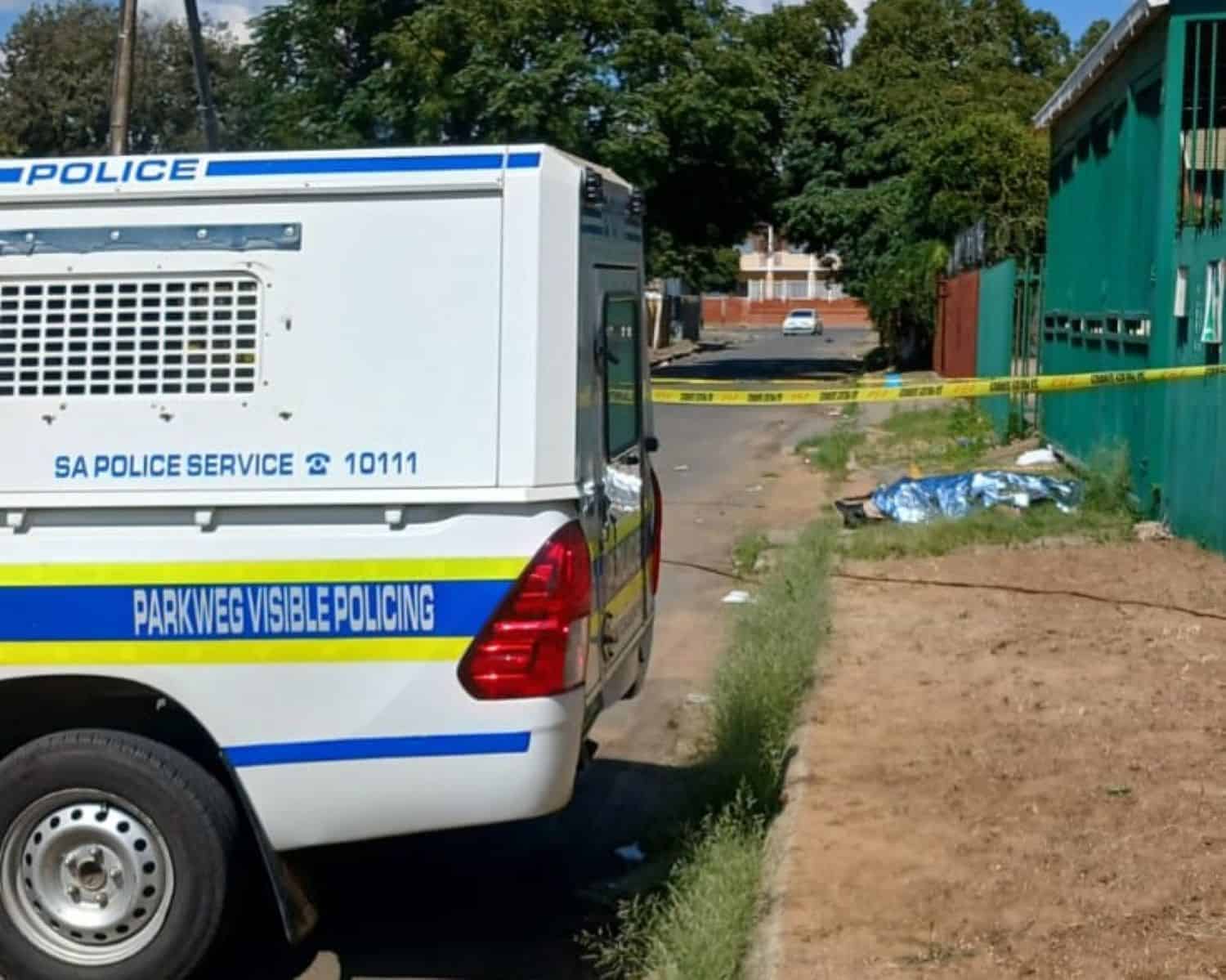 The crime scene where the body of a 19-year-old male was found with multiple stab wounds.