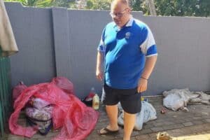 Ward 92 Clr Kade Guerreiro points to the waste left by homeless