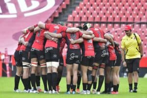 Lions players in a huddle