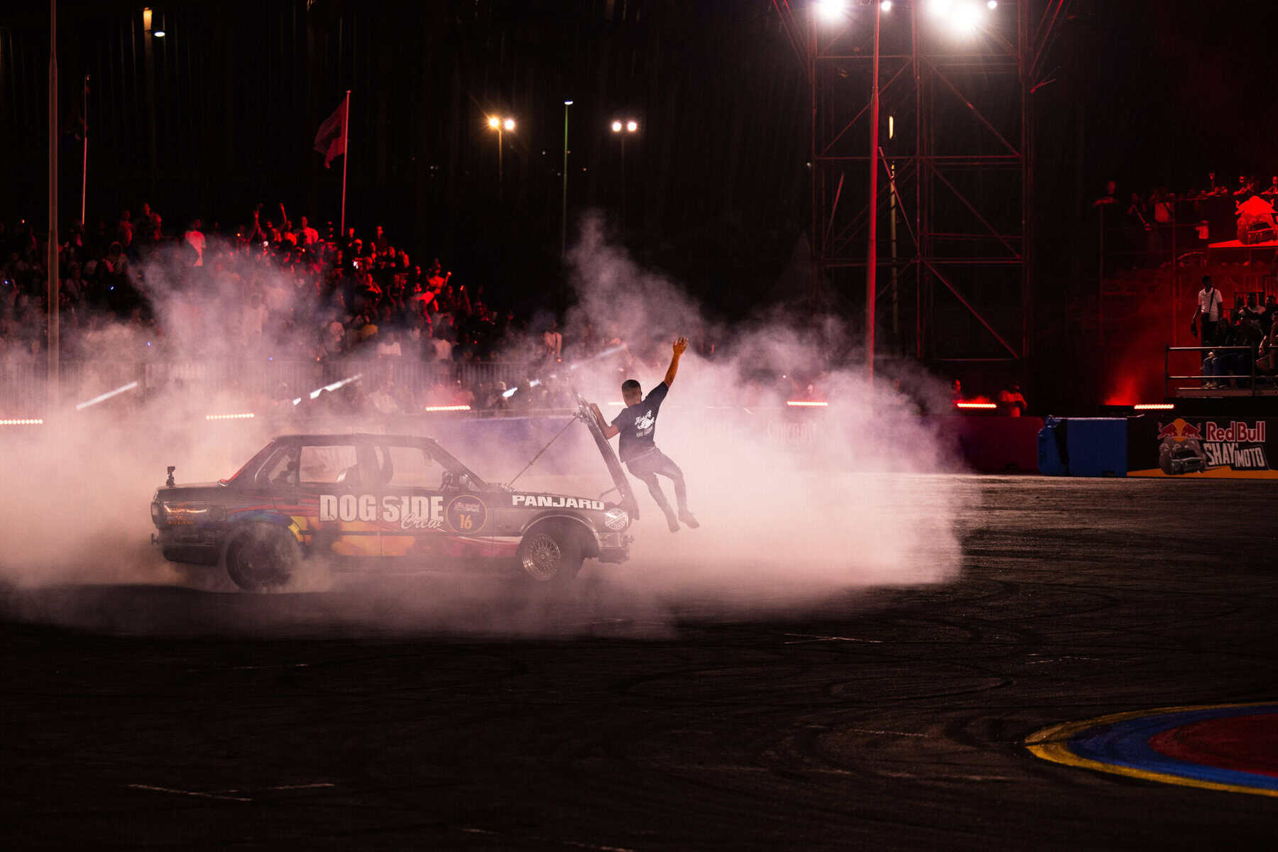 Driver jumping off the bonnet of his car