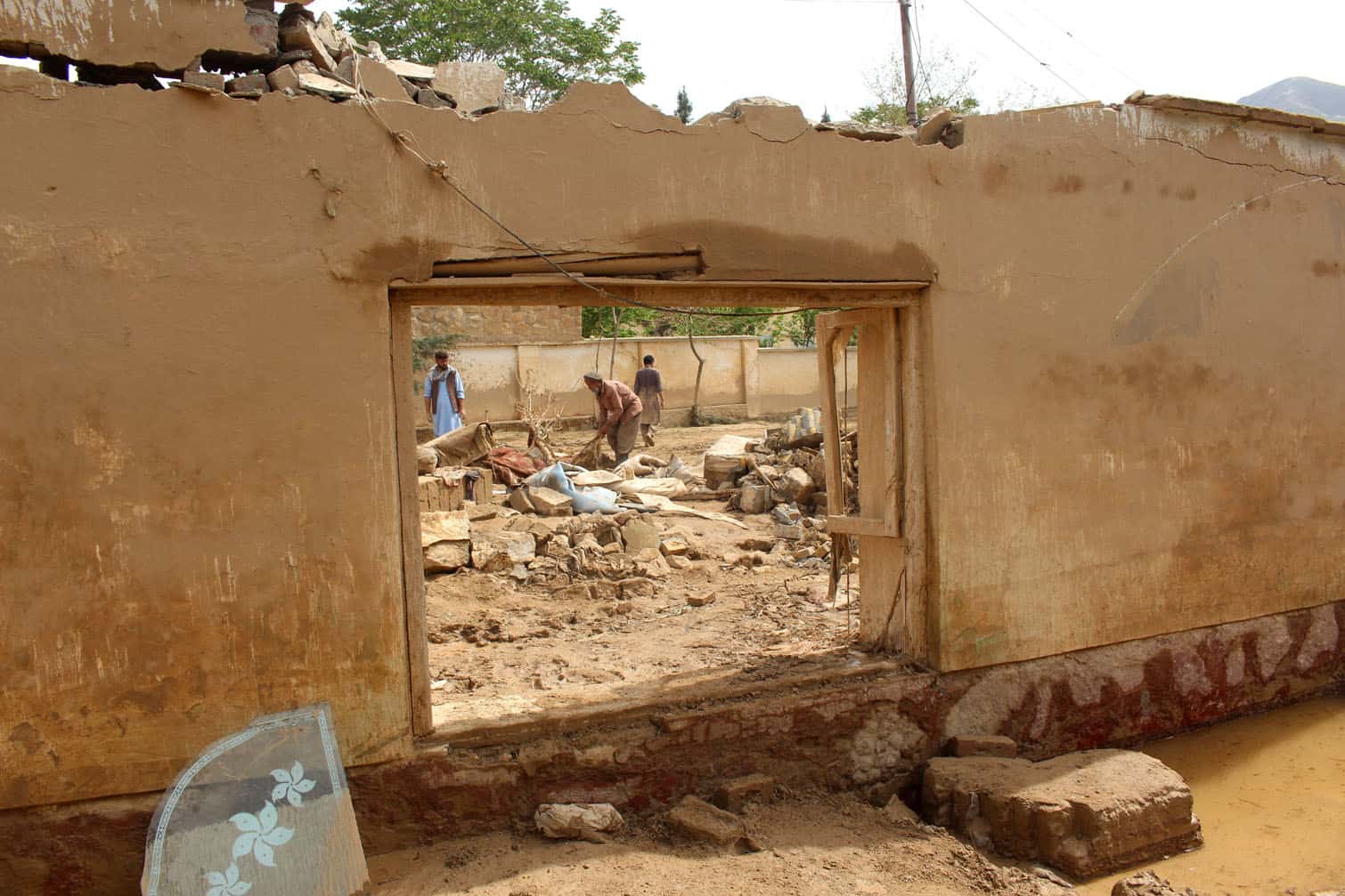 Afghan men search for their household goods