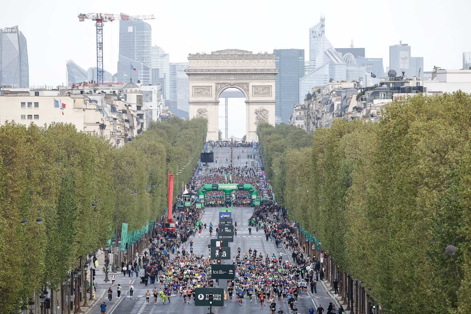 Athletes take the start on the Champs-Elysees avenue