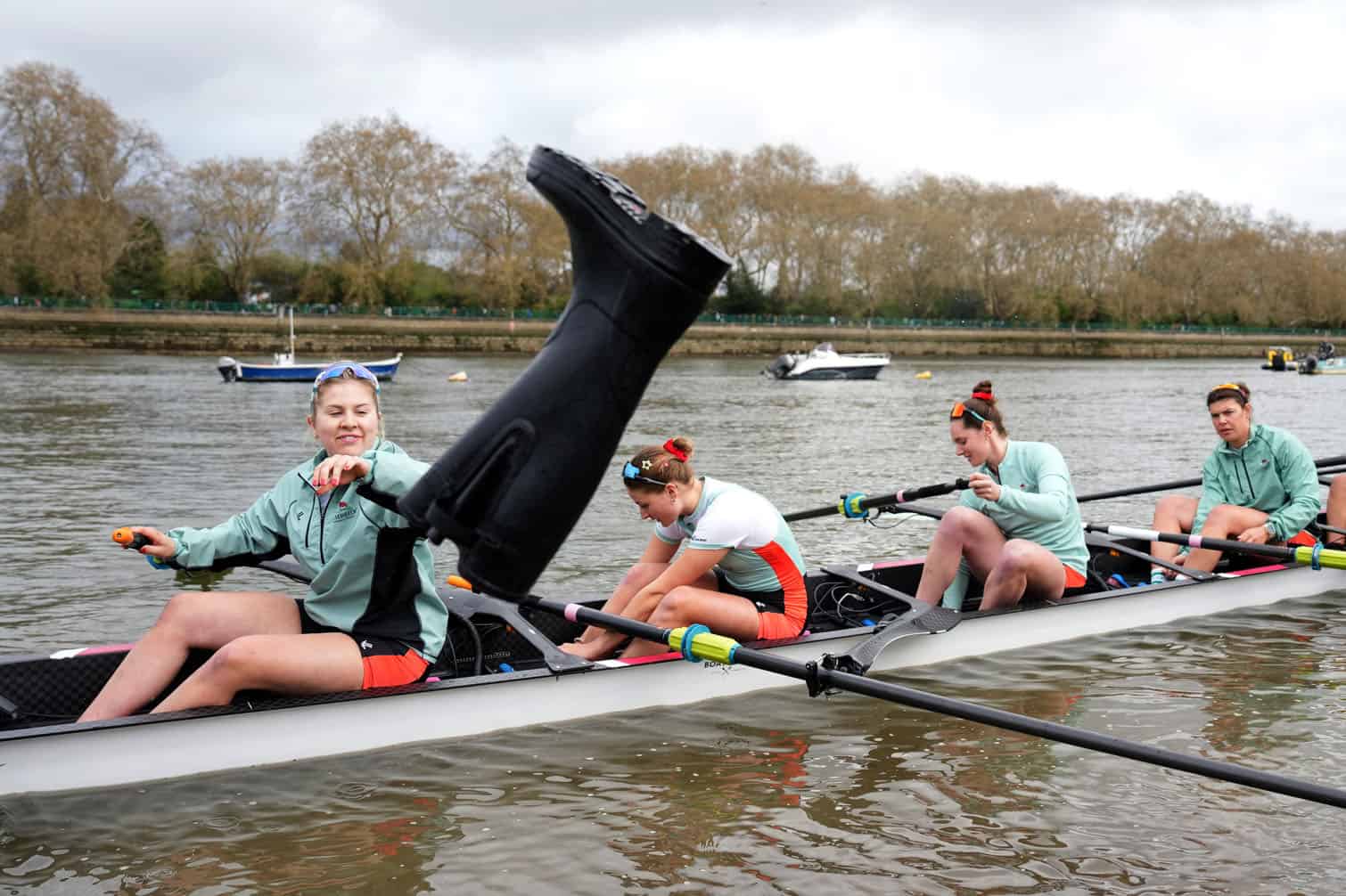 Wellies are discarded from the Cambridge boat