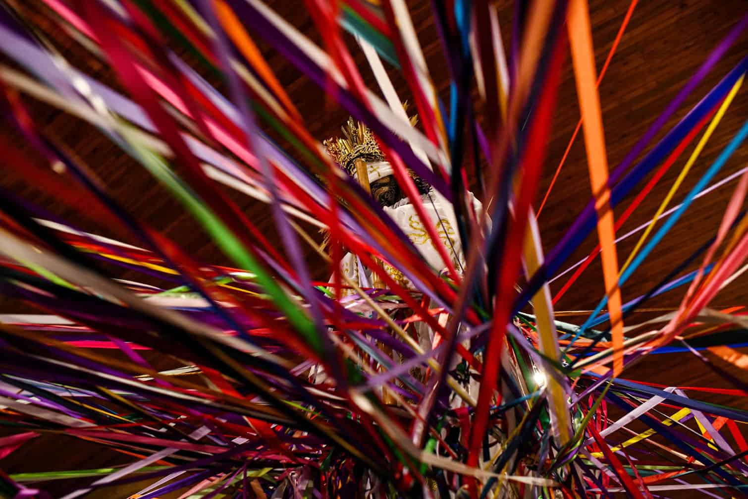 Catholic faithful hold colored tape