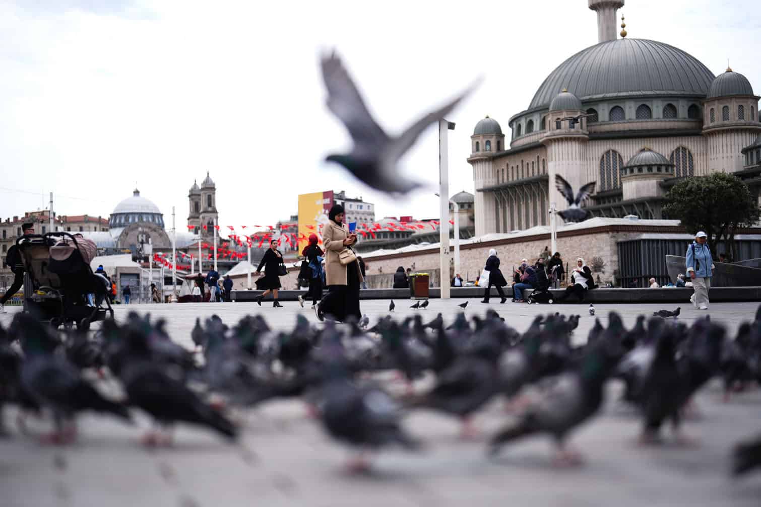 People spend time at Taksim square