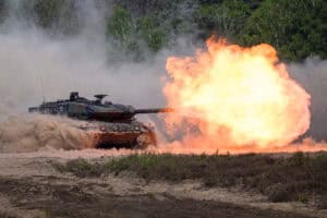 A Leopard 2A6 tank fires during a demonstration