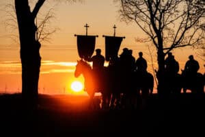 Sorbian horsemen sing as they ride on horses