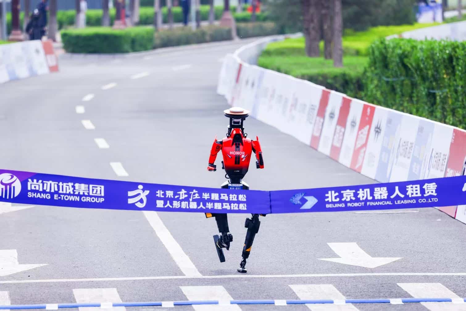 Humanoid robots break half marathon world record in China