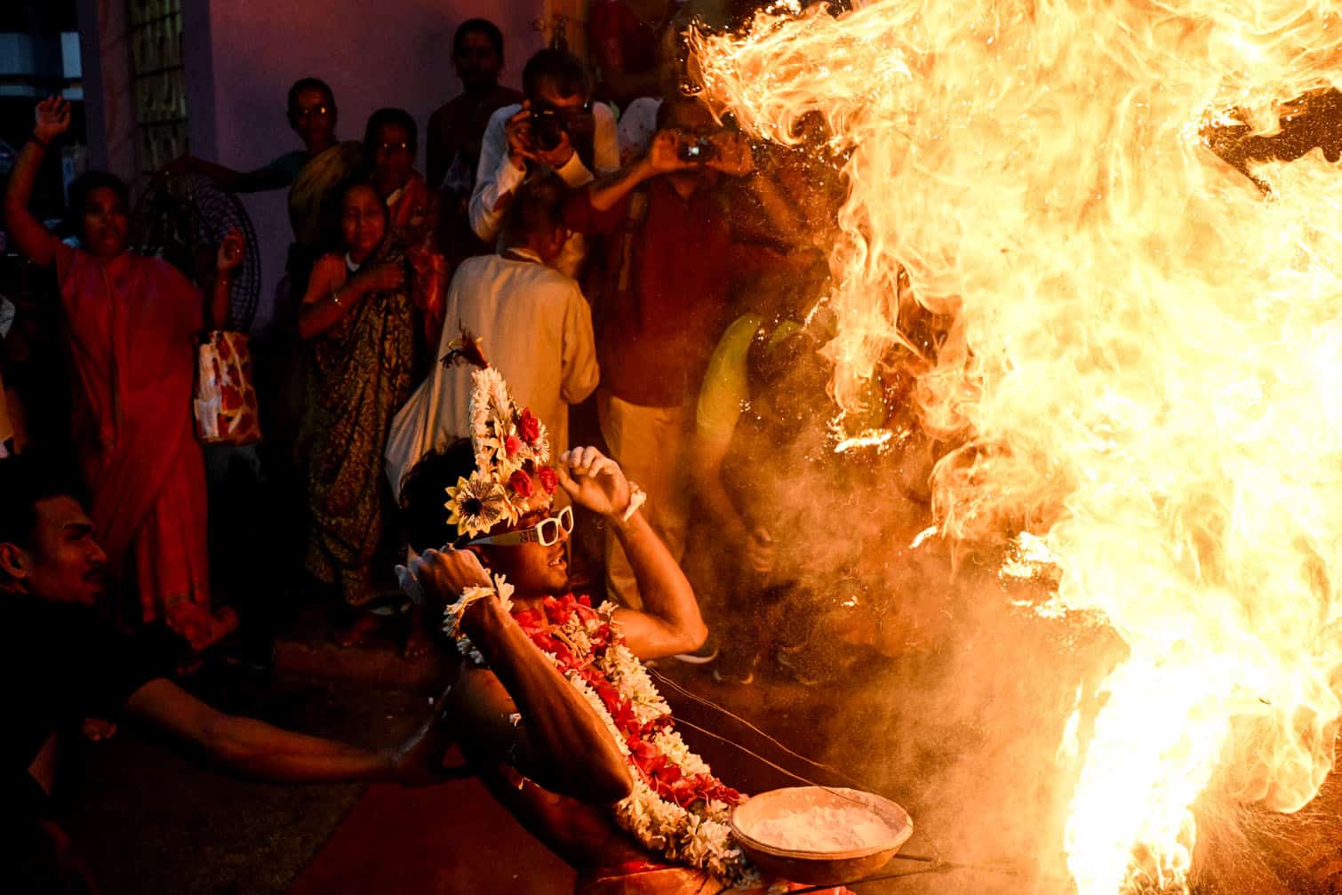 Hindu devotees ignite flammable holy powder