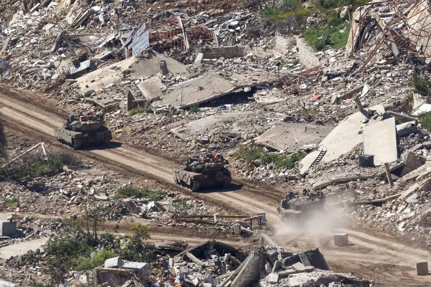 an Israeli tanks driving along the road