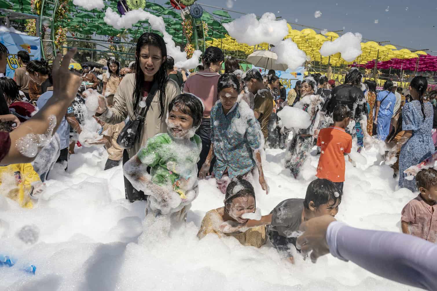 People play with soap suds