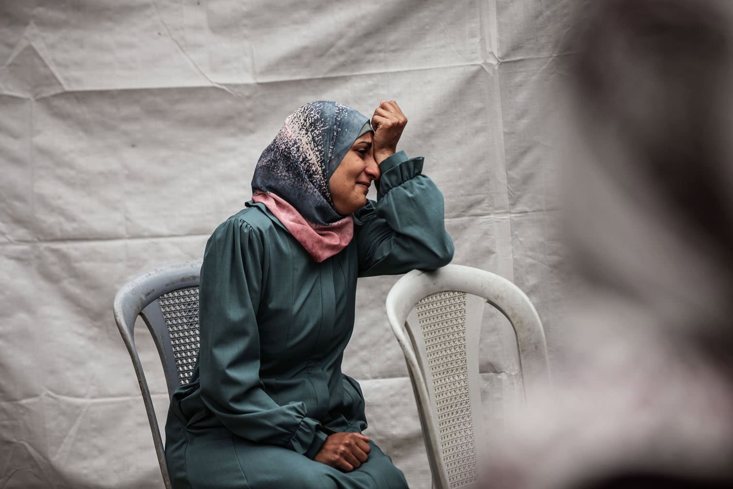 Relatives of the deceased, including children, mourn