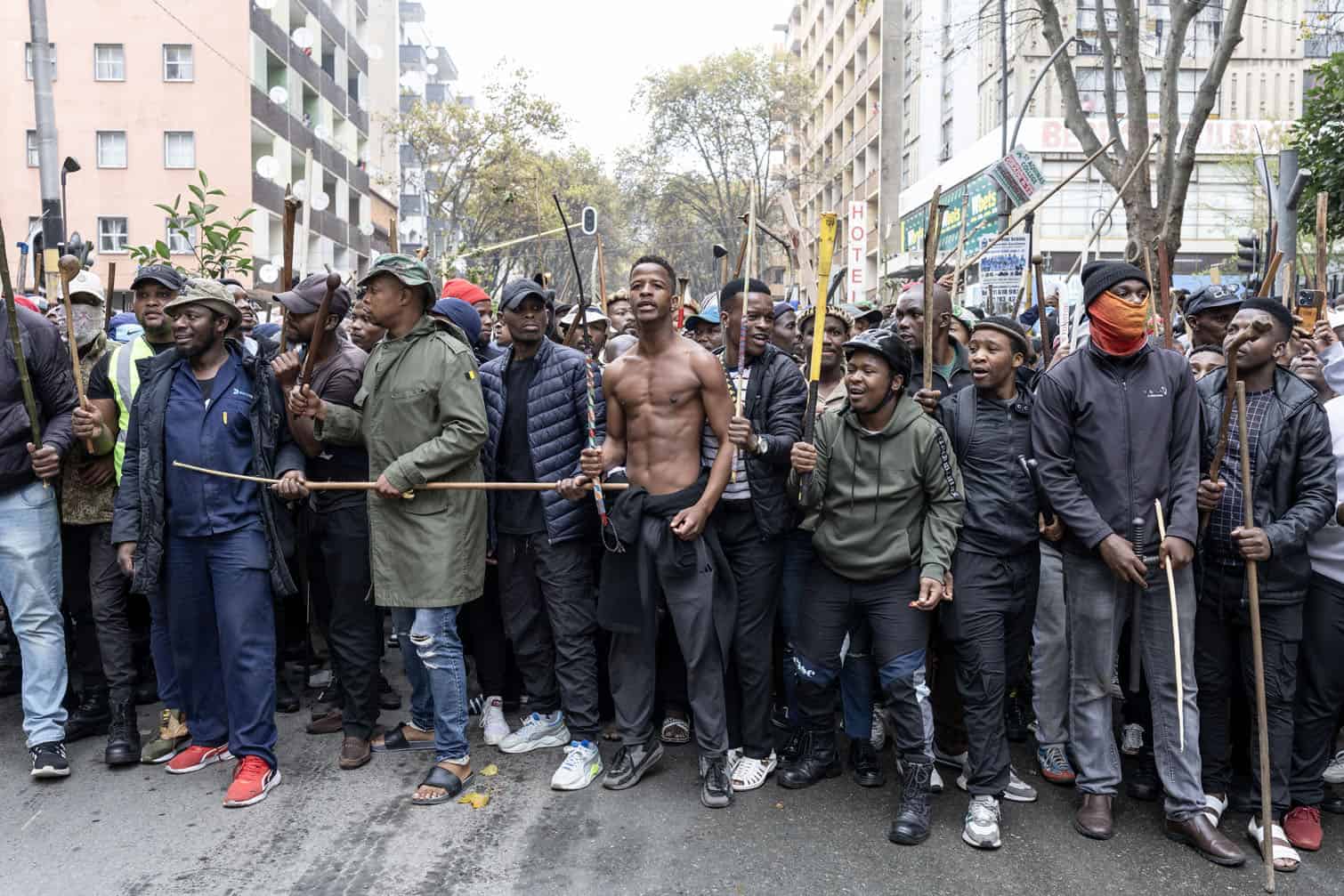 Protesters gesture during a protest march