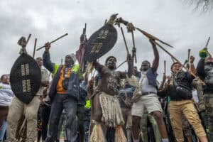 Protesters sing and chant during a protest march against undocumented migrants