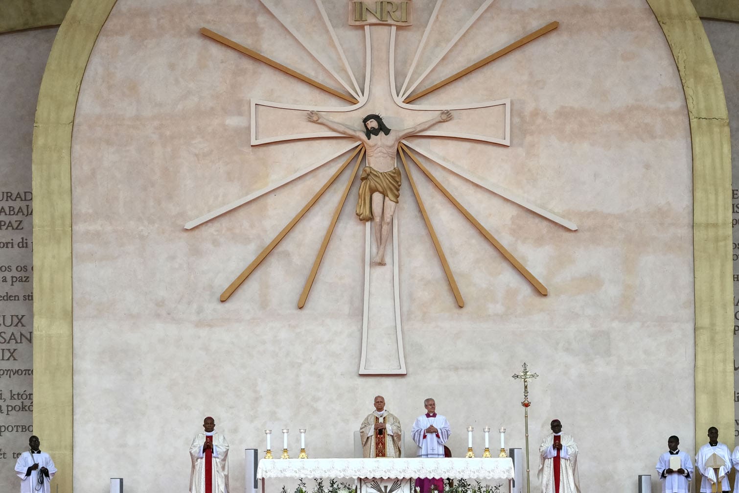 Pope Leo XIV (C) leads a Holy Mass at the Malabo Stadium