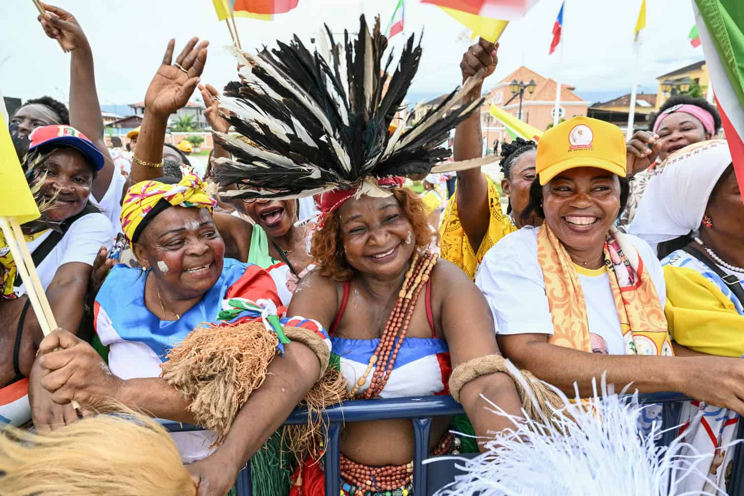 Residents cheer as they gather outside for Pope Leo XIV