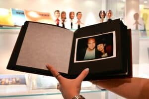 A photo album given by US actress Jennifer Aniston to fellow "Friends" cast members Matthew Perry and Courtney Cox, is displayed ahead of "The Matthew Perry Estate Auction" at Heritage Auctions in Beverly Hills, California, on May 19, 2026. From artwork by Banksy to scripts from the smash TV series "Friends," dozens of Matthew Perry's personal belongings are up for auction in the US. The executors of his estate have put some 130 lots up for auction, including his favorite watch and childhood mementos, to raise money for the Matthew Perry Foundation, an organisation dedicated to helping people with addiction. Perry, who played the neurotic and sarcastic Chandler Bing, died in 2023 at the age of 54 after decades of battling addictions. Picture via Frederic J. BROWN / AFP