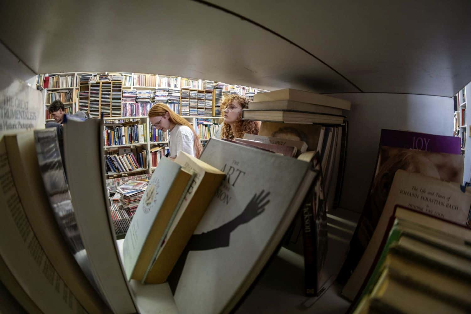 Younger customers peruse the shelves at Bookdealers of Melville on 4 April 2026. The store has been at the same location on 7th Street for 30 years. Picture: OUR CITY NEWS/Ihsaan Haffejee