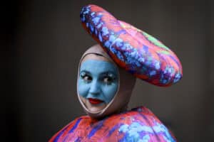 A performer wears a coral reef-inspired costume