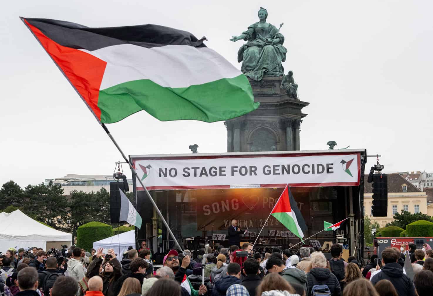 Participants wave Palestinian flags